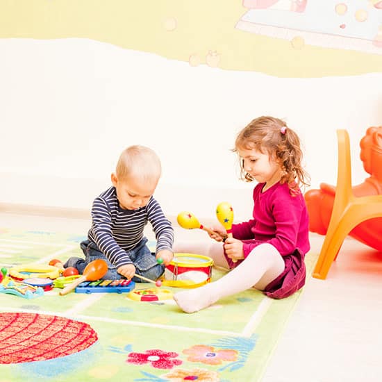 Three kids playing with toys